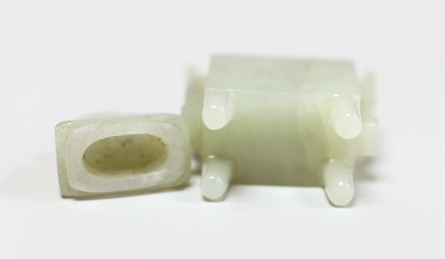 A Chinese pale celadon jade miniature ‘fanghu’ vessel, 6cms high